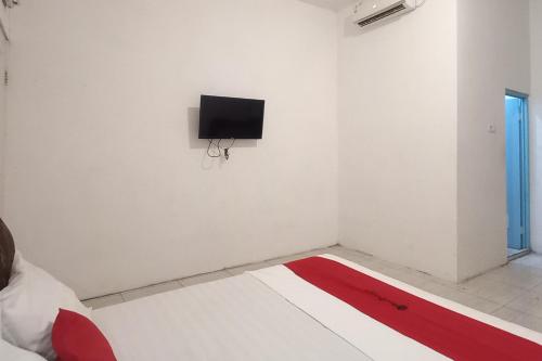 reddoorz syariah near rs siti khodijah sepanjang