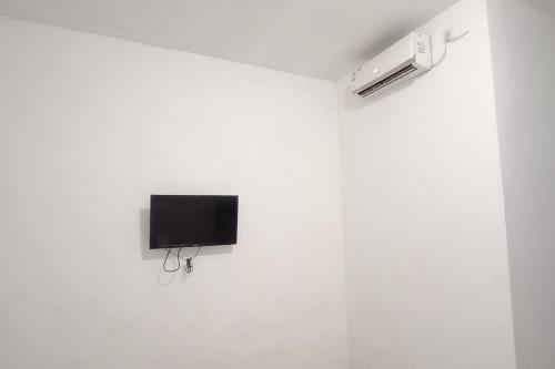reddoorz syariah near rs siti khodijah sepanjang