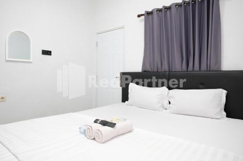 aster triplets guest house jcm mitra reddoorz
