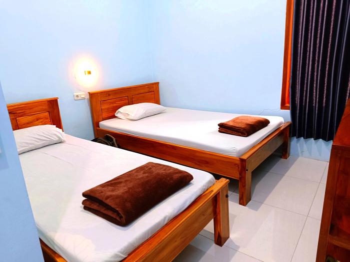 wisma kencana syariah near uns mitra reddoorz