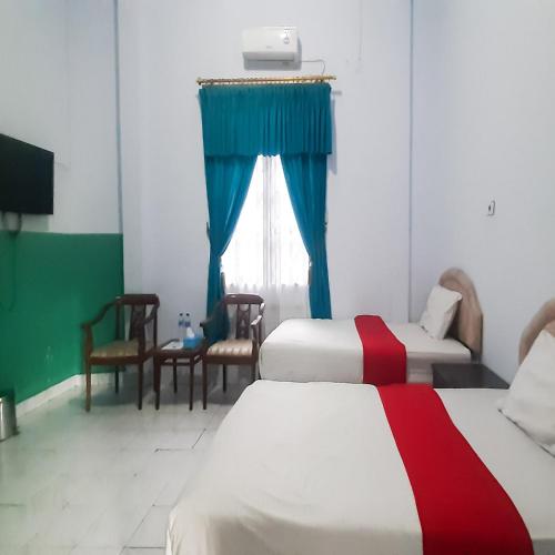 hotel niaga mitra reddoorz