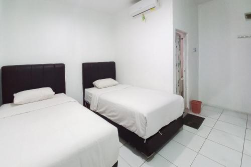 joy guesthouse pekanbaru mitra reddoorz