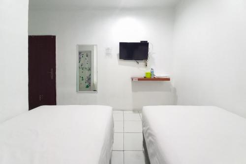 joy guesthouse pekanbaru mitra reddoorz