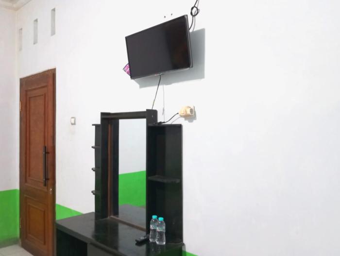 puspa tiara syari guci mitra reddoorz