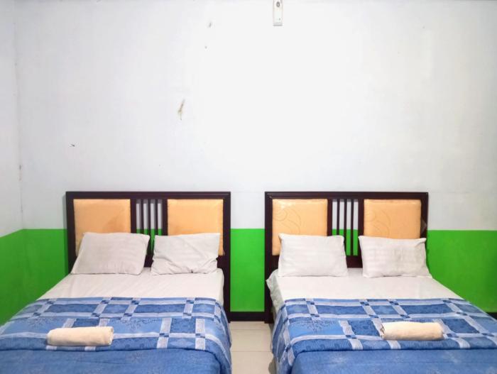 puspa tiara syari guci mitra reddoorz