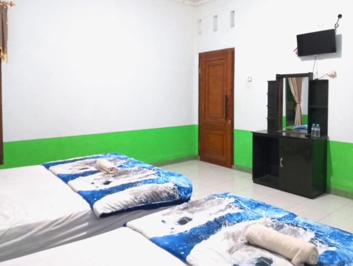 puspa tiara syari guci mitra reddoorz