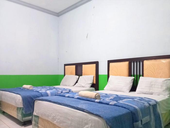 puspa tiara syari guci mitra reddoorz