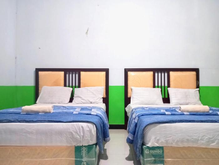 puspa tiara syari guci mitra reddoorz
