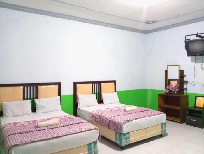 puspa tiara syari guci mitra reddoorz