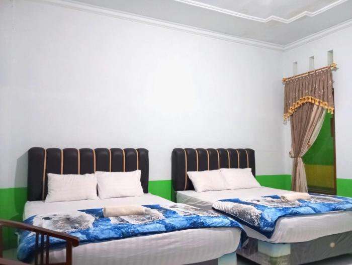 puspa tiara syari guci mitra reddoorz