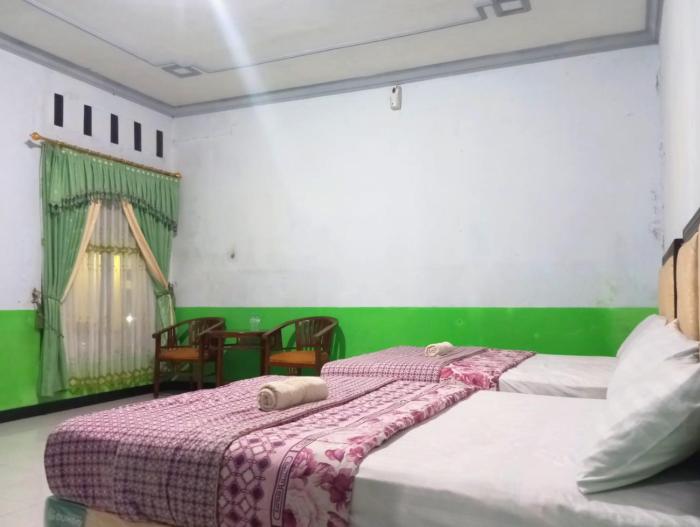 puspa tiara syari guci mitra reddoorz