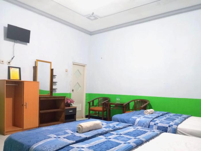 puspa tiara syari guci mitra reddoorz