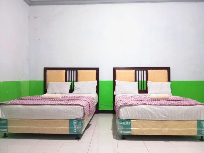 puspa tiara syari guci mitra reddoorz
