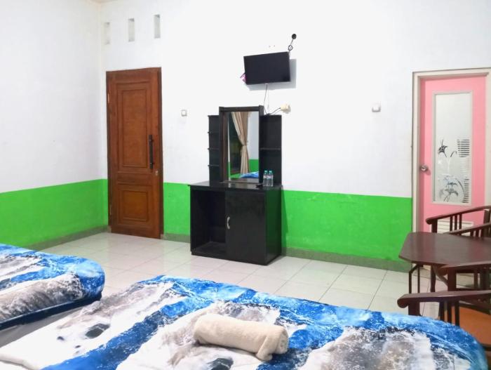 puspa tiara syari guci mitra reddoorz