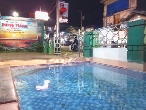 puspa tiara syari guci mitra reddoorz