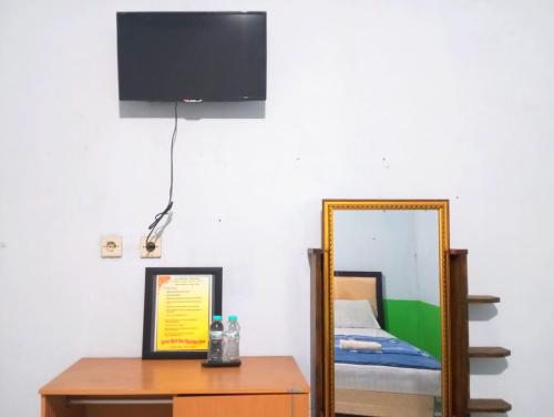 puspa tiara syari guci mitra reddoorz