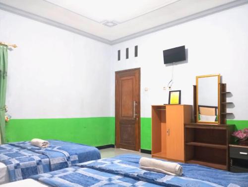 puspa tiara syari guci mitra reddoorz