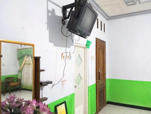 puspa tiara syari guci mitra reddoorz