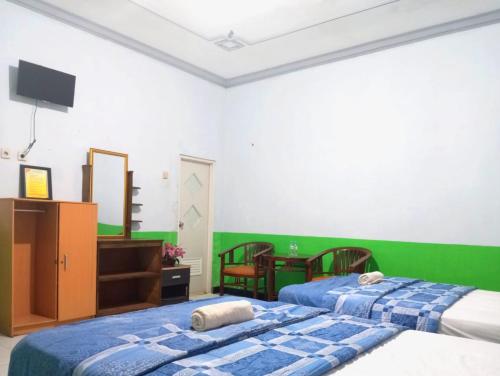 puspa tiara syari guci mitra reddoorz