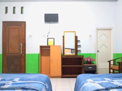 puspa tiara syari guci mitra reddoorz