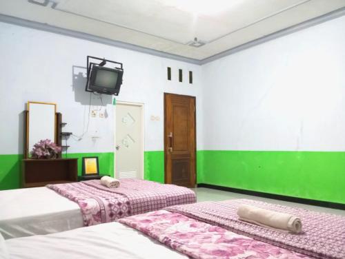 puspa tiara syari guci mitra reddoorz
