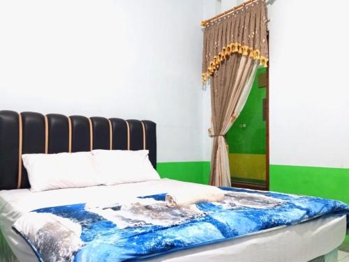 puspa tiara syari guci mitra reddoorz