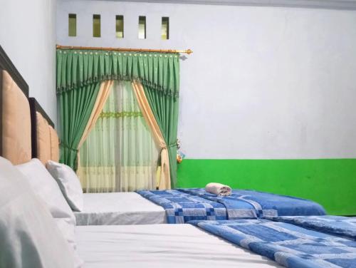 puspa tiara syari guci mitra reddoorz