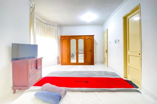 reddoorz near taman bunga nusantara 2