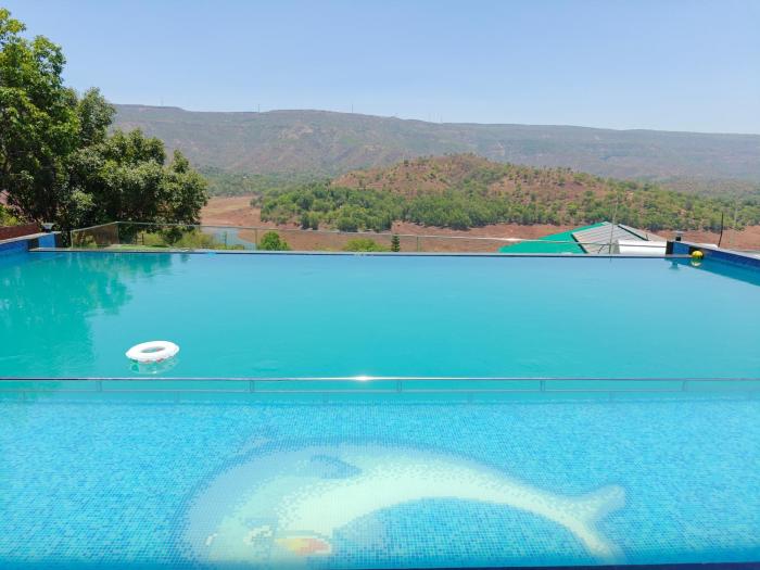 nisarga lake resort tapola