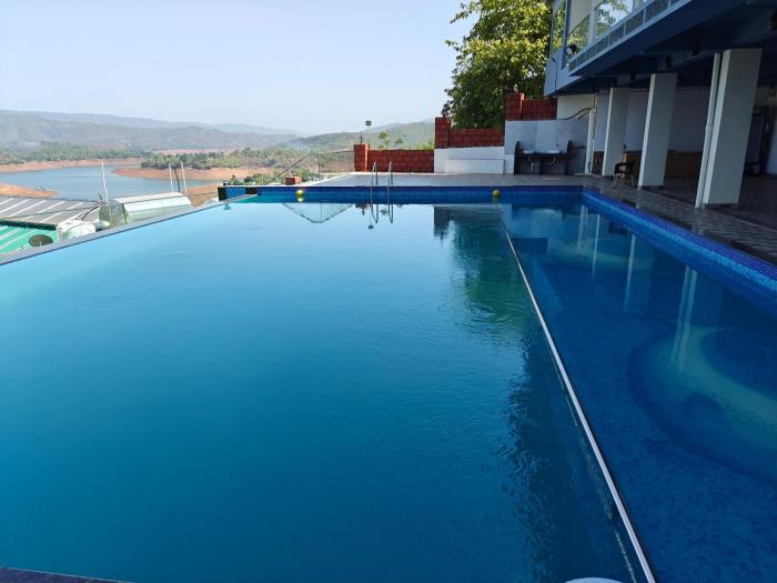 nisarga lake resort tapola