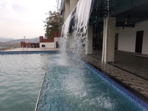 nisarga lake resort tapola