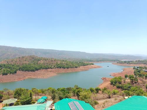 nisarga lake resort tapola
