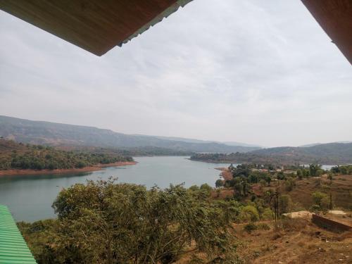 nisarga lake resort tapola