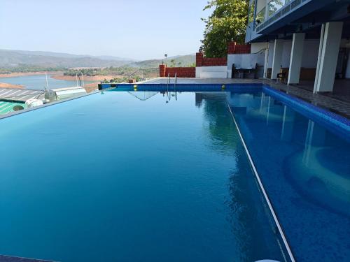 nisarga lake resort tapola