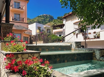 quiete taormina naxos tapestry collection by hilton