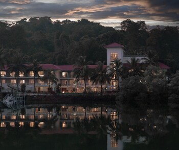 the postcard on the mandovi river