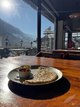 the mountain muse cafe bakery and stay manali