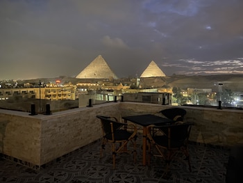 aziz palace front pyramids view and rooftop restaurant