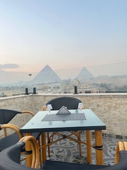 aziz palace front pyramids view and rooftop restaurant