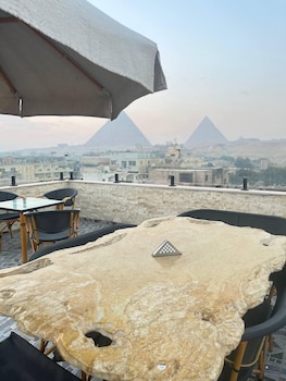 aziz palace front pyramids view and rooftop restaurant