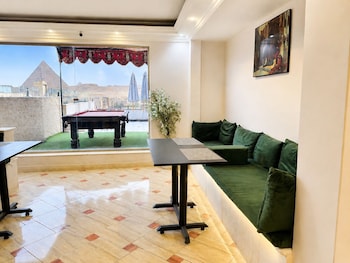 aziz palace front pyramids view and rooftop restaurant