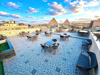 aziz palace front pyramids view and rooftop restaurant