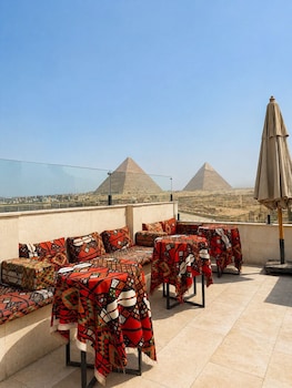 aziz palace front pyramids view and rooftop restaurant