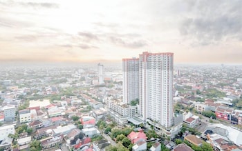 spacious 2br with working room at vida view makassar apartment