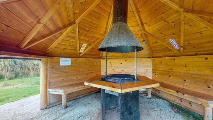 cozy hot tent with log burner and hot tub right tent