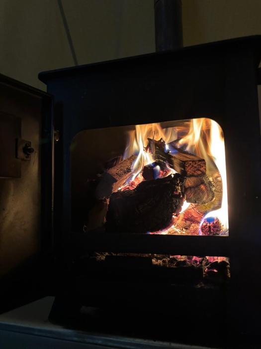 cozy hot tent with log burner and hot tub right tent