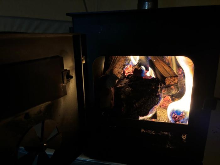 cozy hot tent with log burner and hot tub right tent
