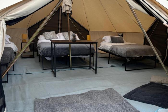 cozy hot tent with log burner and hot tub right tent
