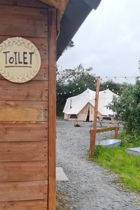cozy hot tent with log burner and hot tub right tent