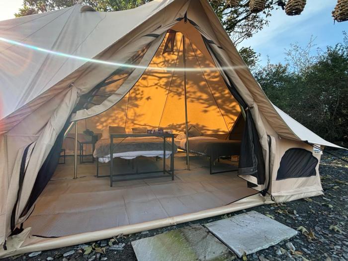 cozy hot tent with log burner and hot tub right tent